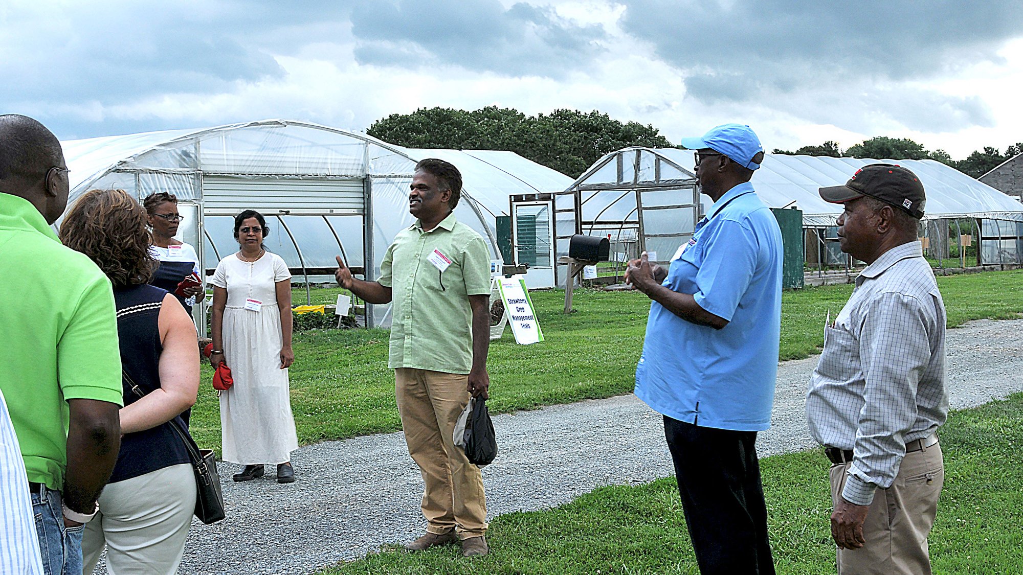 Community members at a greenhouse