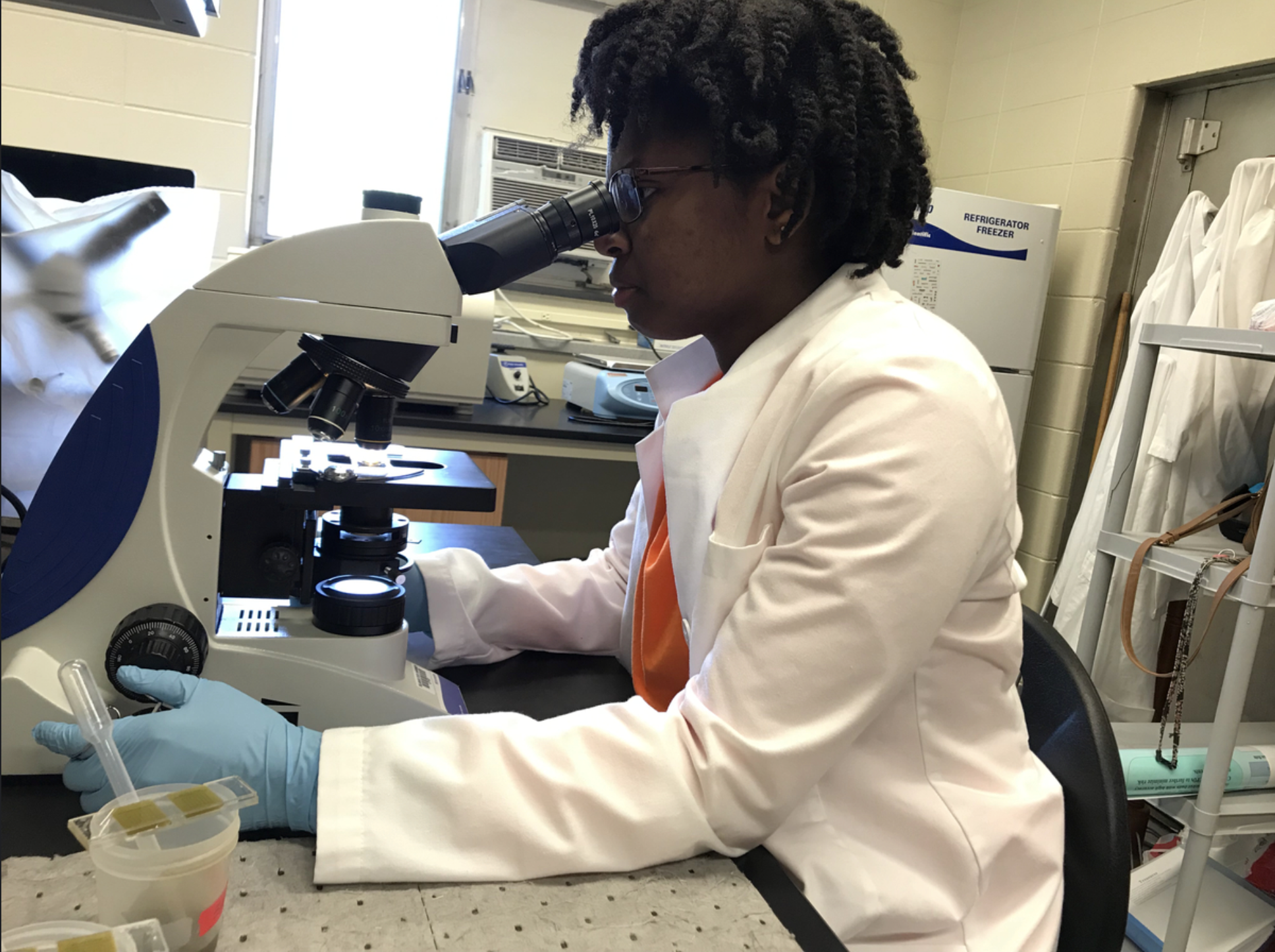 student doinf fecal egg count